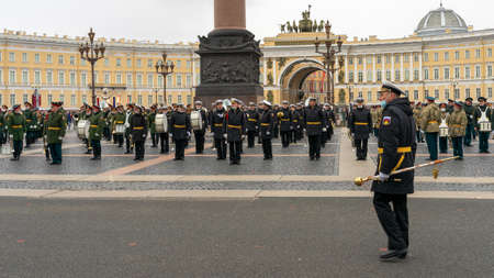 A conductor and a military brass band during the rehearsal of the military parade for the 76th Victory Day on Palace Square, St. Petersburg, Russia, beside the Alexander Columnのeditorial素材