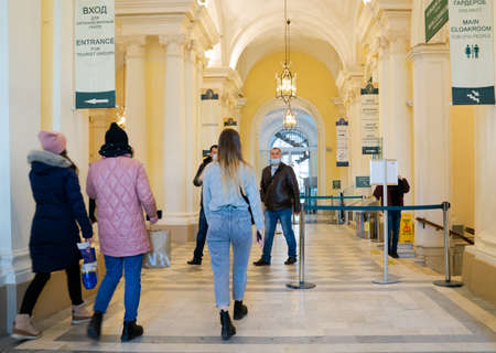 Visitors walking in and leaving the reopened Hermitage museum in St Petersburg, Russia inside the entrance hall.のeditorial素材