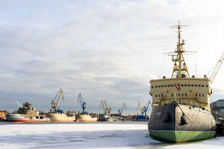 ST PETERSBURG, RUSSIA-MARCH 31, 2021: The legendary icebreaker Krassin, moored and sitting on the ice of Neva river, as a museum. Legendary vessel was used in WWII and Polar ocean explorations.のeditorial素材