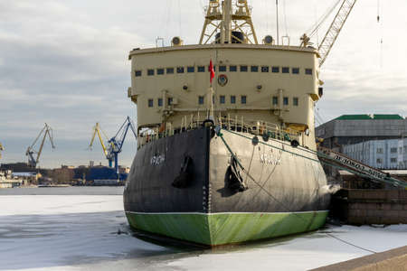 ST PETERSBURG, RUSSIA-MARCH 31, 2021: The front view of the legendary icebreaker Krassin, moored and sitting on the ice of Neva river, now a museum. She used to be one of the most powerful icebreakers in the world.のeditorial素材