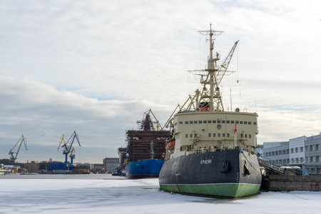 ST PETERSBURG, RUSSIA-MARCH 31, 2021: The legendary icebreaker Krassin, moored and sitting on the ice of Neva river, now a museum. She used to be one of the most powerful icebreakers in the world.のeditorial素材