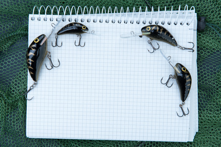 fishing accessories and a paper notebookの写真素材