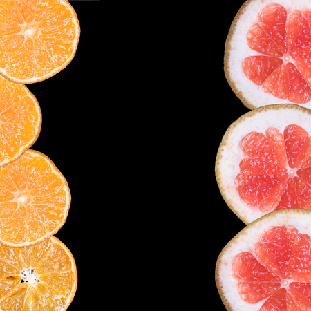 frame of fresh fruit on a black background, with space for textの写真素材