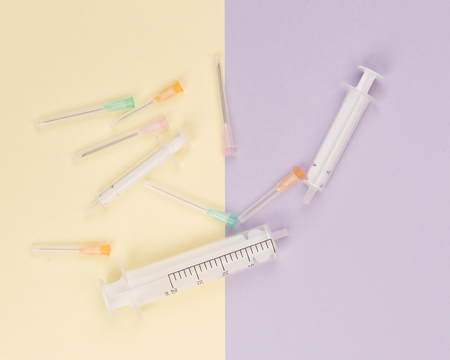 syringe on a colored background - cosmetic surgery