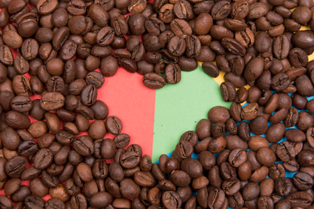 Coffee seeds on a colored backgroundの写真素材