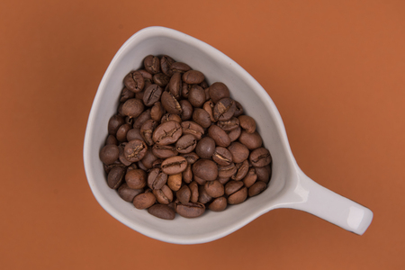 Coffee seeds on a colored backgroundの写真素材
