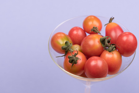 cherry tomatoes on colorful backgroundsの写真素材