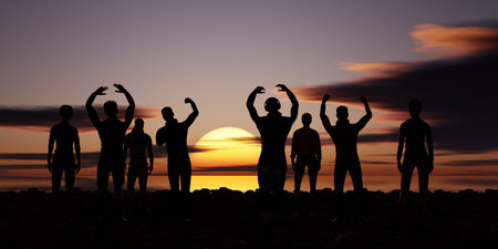 Silhouette of a group of people with raised hands against the sunsetの写真素材