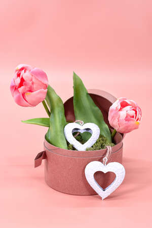 Valentine's Day flowers with hearts.Image with tulips on pink background for Valentine's Day, International Women's Day, birthday and declaration of love postcards, greeting cards and posters.の写真素材