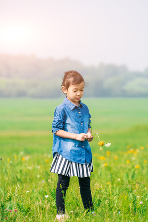 A girl playing on the prairieの写真素材