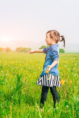 A girl playing on the prairieの写真素材