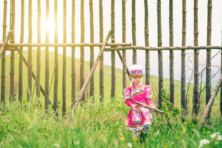 Chinese little girl in traditional Mongolian costumeの写真素材