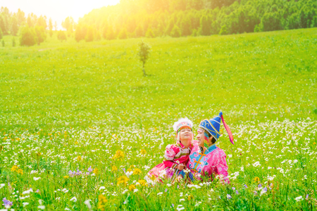 Mother and daughter wearing Mongolian costumes on the grasslandの写真素材
