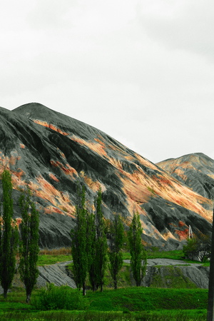 rock dump Donetsk Ukraine, a pile of rock left near a non-functioning mine is washed away by the rain blown by the wind pollutes the environmentの写真素材