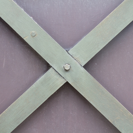 photo of a cross of wood backkground textureの写真素材