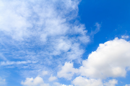 Photo of Distribution of white clouds on the clear blue sky for background textureの写真素材