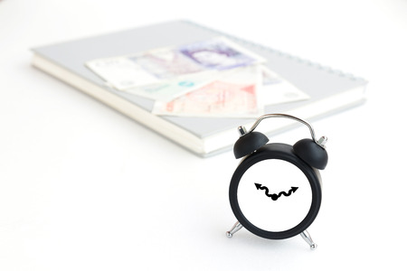 Clock, money and book isolated on whiteの写真素材