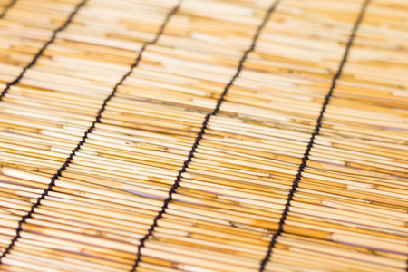 Photo of  a small bamboo lined with a rope. Used for curtainの写真素材