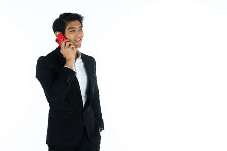 Handsome young businessman Asian caucasian wear a black suit with black hair, be a smile and...
