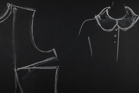 Group of sewing objects lying flat on a black chalkboard background. Horizontal background for ad or packaging.の写真素材