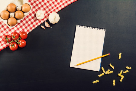 Food ingredients background. Photograph taken from above, top view. Horizontal concept image for restaurant advertising or mock-up. Lots of copy space for text around objectsの写真素材