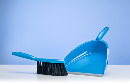 Cleaning concept backround. Assorted products isolated on white and blue backdrop. Studio product shot for advertising, website or blog.の写真素材