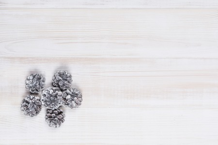 Christmas decoration background. Winter ornaments on a white wooden table. Product photo taken from...
