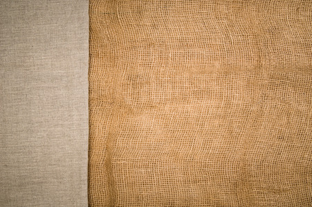 Linen fabric background with visible texture. Horizontal photo taken from above, top view with copy space for packaging, text and other web or print design elements.の写真素材