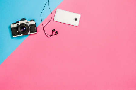 Flat lay photo of a creative freelancer woman workspace desk with copy space background. Image taken from above, top view. Minimal style with colorful paper backdropの写真素材