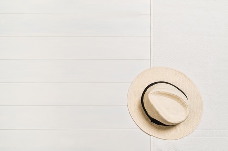 Top view of beach summer accessories with copy space. Lay flat holiday fashion background on white wooden table or floor. Horizontal frame for spa or wellness concept.の写真素材