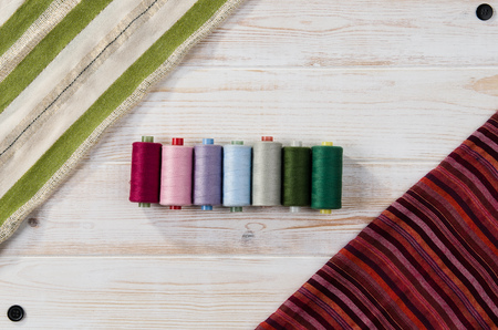 Concept image of sewing accessories. Image taken from above, top view. Background for creative...