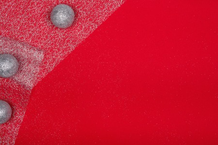 Christmas decoration over red background. Photo taken from above, top view with copy space for text...