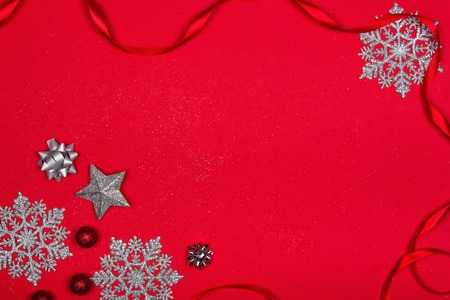 Christmas decoration over red background. Photo taken from above, top view with copy space for text or other design elements.の写真素材