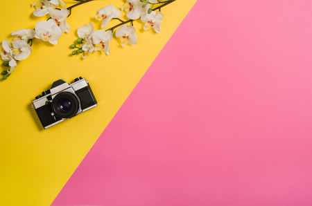 Top view of colorful, graphical sandy beach with summer accessories and copy space around products. Blank mock up for advertising or packaging. Colourful frame with graphical backdropの写真素材