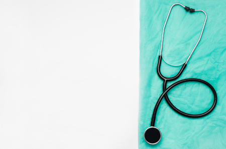 Top view of modern, sterile doctors office desk. Medical accessories on a white table background with copy space around products. Photo taken from above.の写真素材