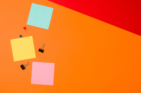 Sticky notes reminder on colorful office table or desk seen from above. Top view product photograph. Concept image with blank copy spaceの写真素材