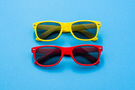 Modern sunglasses on colorful background with copy space. Product photograph with room for text.の写真素材