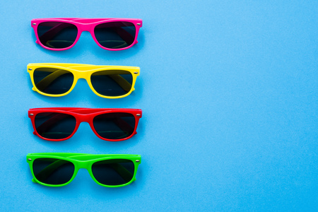 Modern sunglasses on colorful background with copy space. Product photograph with room for text.の写真素材