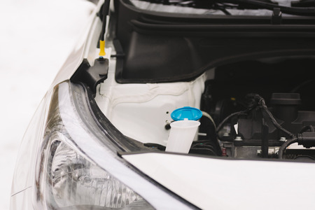 Car engine closeup with copy space. Outdoor photo showing concept winter car problems with ignition.の写真素材