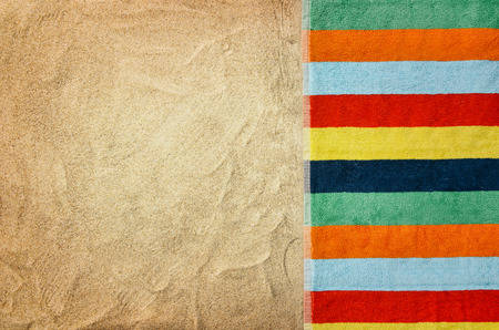 Top view of sandy beach with towel frame. Background with copy space and visible sand texture.の写真素材