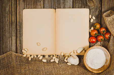 Baking or cooking ingredients background. Top view photograph with kitchen utensils on vintage, natural, raw, wooden background with visible texture.の写真素材