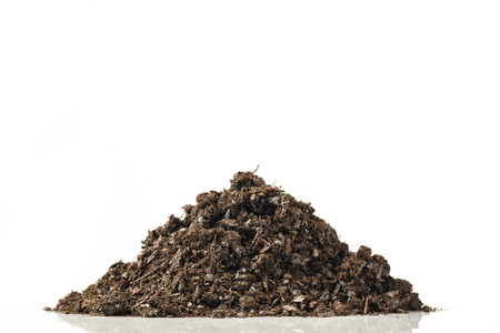 Fertile soil pile isolated on white background.の写真素材