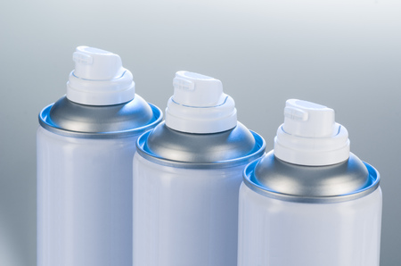 Aerosol spray cans nozzle closeup. Spray cans with shallow depth of field. Air freshener product studio photographの写真素材