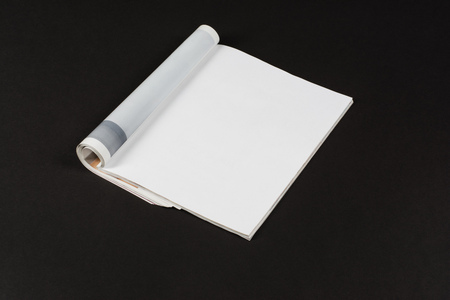 Mock-up magazine or catalog on black table. Blank page or notepad on paper background. Blank page or notepad for mockups or simulations.の写真素材