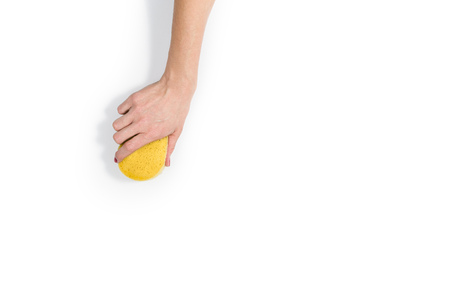 Isolated womans hand cleaning on a white background. Cleaning or housekeeping concept background. Frame for text or advertisingの写真素材