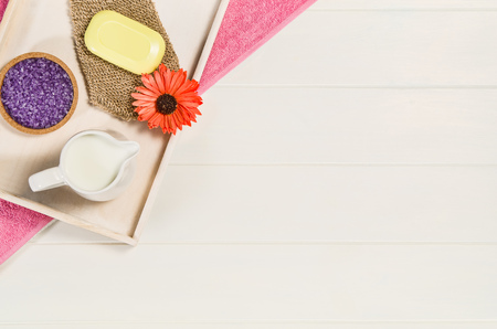 Spa frame top view. Background on white wooden table or floor with copy space. Wellness salon...