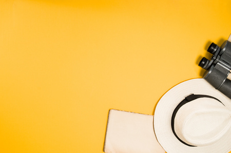 Accessories for travel top view on yellow background with copy space. Beach adventure and wanderlust concept image with travel accessories. Sunbathing and relaxingの写真素材