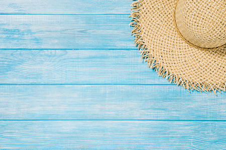 Top view of blue planks marine pier near the beach. Frame composition with summer accessories. Background with copy space and visible wood texture. Border compositionの写真素材