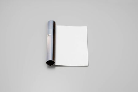 Mock-up magazine, newspaper or catalog on gray background. Blank page