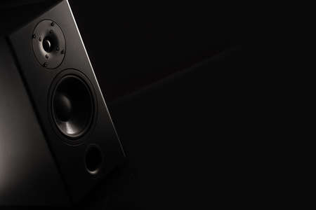 Stereo sound speakers closeup on black background with copy spaceの写真素材